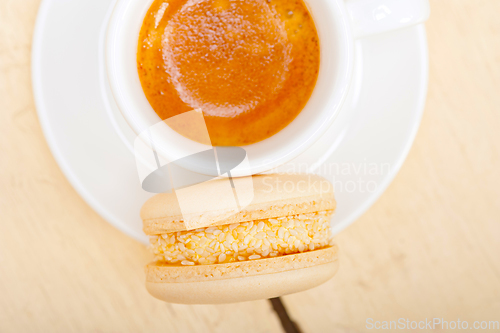 Image of colorful macaroons with espresso coffee