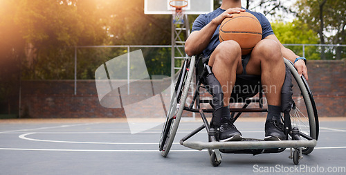 Image of Wheelchair, basketball and man with sports ball at outdoor court for fitness, training and cardio. Exercise, hobby and male with disability at a park for game, workout and weekend fun or active match