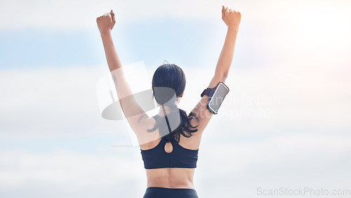 Image of Fitness, celebration and woman with arms up in cloudy sky, mockup and winning achievement in nature. Ocean, goals and exercise girl for workout motivation, winner victory and success in natural space