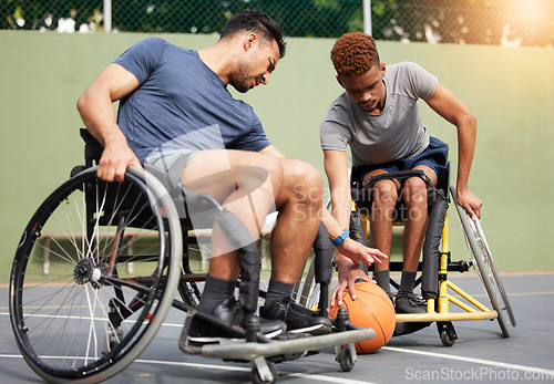 Image of Sports, basketball and men in wheelchair playing for training, exercise and workout on outdoor court. Fitness, team and male people with disability tackle for ball for competition, practice and games