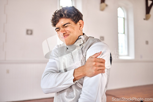 Image of Fencing, man and shoulder pain, injury or accident after training, exercise or workout in club. Fencer, body problem and athlete with arthritis, fibromyalgia or osteoporosis, wound and emergency