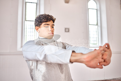 Image of Sports, fencing and man stretching for exercise, training and workout for competition in studio. Fitness, sword fighting and male person warm up arms getting ready for challenge, match and practice