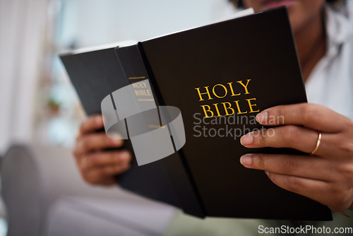 Image of Hands, bible and woman reading in home, lounge and book of prayer, religion and worship faith in study of mindfulness. Person, praying and studying holy books for peace, praise and meditation