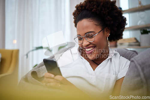 Image of Laughing, meme and woman with phone on a couch using the internet, web and search on social media for joke. Online, smartphone and person relax on a sofa with mobile connection or online shopping