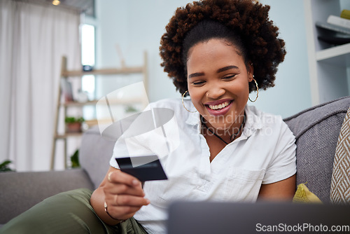 Image of Happy black woman, laptop and credit card for ecommerce, payment or banking on sofa at home. African female person or shopper smile with debit on computer app for online shopping, purchase or buying