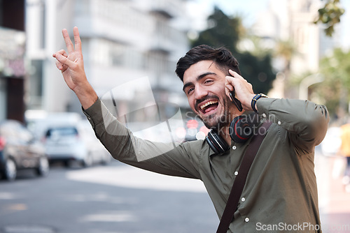 Image of Man, phone call and wave for taxi, city and smile for peace sign language, emoji or funny face on sidewalk. Young entrepreneur, smartphone and street to stop bus, transportation and driver for travel