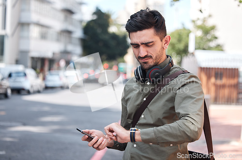 Image of Business man, check watch and street with thinking, travel and waiting for transportation in metro cbd. Young entrepreneur, clock and schedule on sidewalk for taxi, bus or chauffeur for drive to work