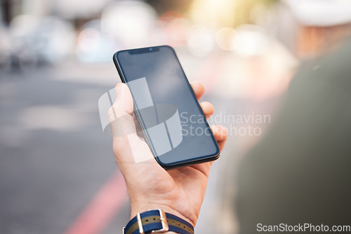 Image of Phone, mockup and hands of man in a city with connection, contact and app for a location. Cellphone, screen and male online for directions, search internet and guide with network, street and travel