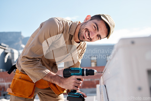 Image of Engineer man, roof and portrait for air conditioning maintenance, smile or building in city for construction job. AC repair, hvac tech and happy technician with drill, tools or industry in Cape Town