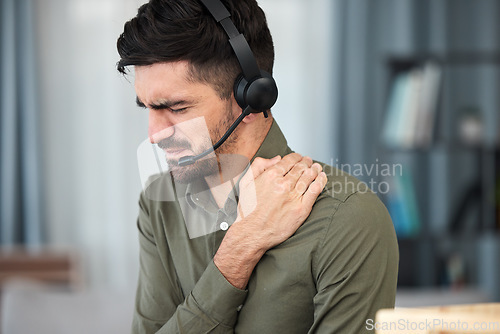 Image of Call center man, shoulder pain and stress in office, communication expert or consultant with emergency. Young telemarketing agent, crm and muscle injury with accident, problem or fatigue in workplace