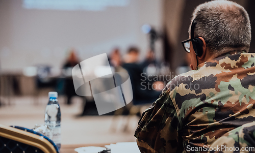 Image of Photo of a soldier leading a seminar for professional training of military personnel