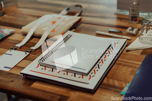 Image of A group of documents and a schedule on the table prepared for the beginning of the seminar