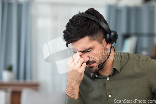 Image of Telemarketing, tech support and man with a headache, burnout and overtime with stress, pain and tension. Male person, employee and consultant with a migraine, health problem and agent with fatigue