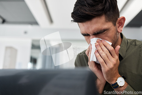 Image of Business man, blowing nose and tissue in office with flu, mucus or allergies for healthcare problem. Sick entrepreneur, toilet paper and cleaning for wellness, workplace and virus with cold bacteria