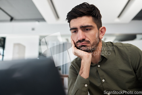 Image of Sad, businessman and working in an office on laptop, desk and workplace with fatigue, tired energy and burnout. Depressed, consultant and work on computer with anxiety for feedback or project email