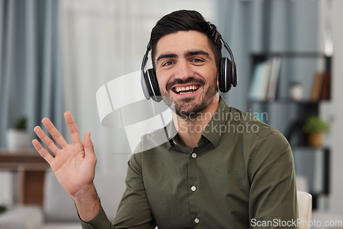 Image of Man, portrait and wave for online meeting, video call and voip communication for telecom advisory help. Face of happy virtual assistant, salesman and consulting with headphones, hello and home office