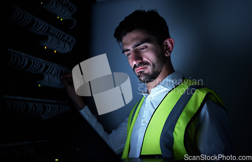 Image of Engineer man, thinking and night in server room for information technology, maintenance and check cables . IT technician, cyber security and ideas for inspection, analytics and dark in data center