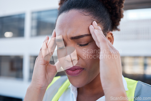 Image of Face, sad and woman in construction with headache at renovation site, civil engineering mistake and stress. Confused, tired and frustrated african contractor with burnout, crisis and problem in city