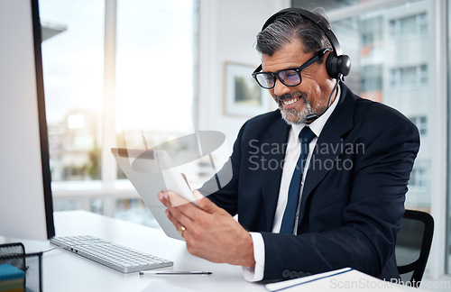 Image of Tablet, call center and mature man in office for customer service, support and crm email. Smile, technology and professional, sales agent or consultant on internet for telemarketing research at desk