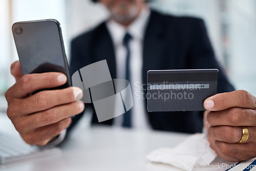 Image of Man, hands and credit card with phone in office for ecommerce, accounting budget or banking investment. Closeup, worker and mobile for online shopping, fintech and trading money in financial economy