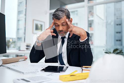 Image of Stress, tired and architect man in an office with a design problem, mistake or deadline for project. Mature male engineer frustrated with headache, fatigue or crisis in construction industry