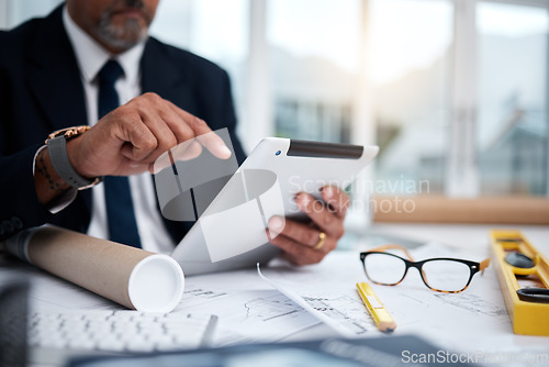 Image of Tablet, hands and architect with research at desk for typing, architecture or planning on internet. Technology, fingers of man and engineer writing, construction design and email for online blueprint