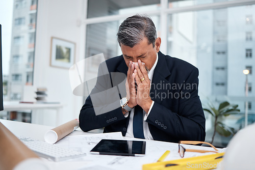 Image of Sick, professional and architect man in an office with tissue for blowing nose at desk. Mature male engineer person frustrated with flu virus, allergies or health problem in construction industry