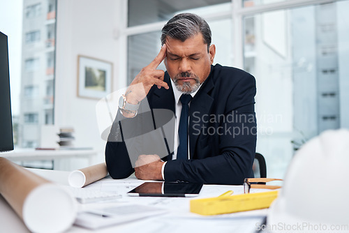 Image of Frustrated, tired and architect man in an office with a design problem, mistake or deadline for project. Mature male engineer stress about headache, fatigue or crisis in construction industry