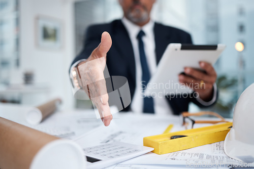 Image of Hand extended, architect and a man in office for a handshake for welcome greeting or deal. POV of male engineer with a tablet and gesture for business negotiation, thank you and agreement or trust