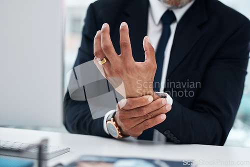 Image of Business man, hands and wrist pain in office from osteoporosis, orthopedic joint and working on computer. Closeup of corporate worker with carpal tunnel injury, fibromyalgia or muscle fatigue at desk