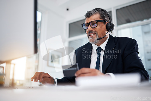 Image of Call center, business man and credit card at computer for financial telemarketing, ecommerce and discount in office. Happy consultant, mature salesman and trading with online banking at desktop pc