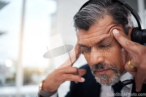 Image of Stress, call center and face of man in customer service agency with pain, burnout or anxiety. Headache, frustrated and tired salesman consulting with challenge, client problem and fatigue for mistake