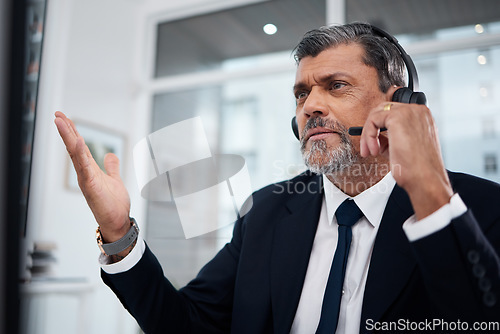 Image of Call center, mature man and confused in office with problem, mistake or crm fail. Serious, telemarketing or frustrated consultant with sales error, glitch crisis or 404 for customer service challenge