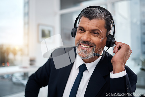 Image of Portrait, call center and mature man with smile for communication, support or customer service. Happy, face and sales manager, telemarketing professional and crm consultant with headphones in office