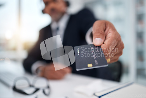 Image of Hand, giving credit card and man in office for payment, ecommerce or budget for shopping in call center. Consultant, crm and banking in closeup for loan, account or bills in telemarketing workplace