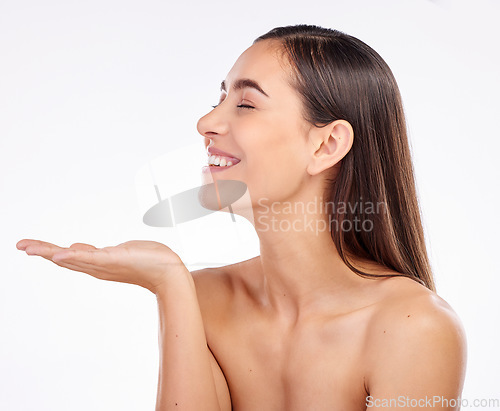 Image of Beauty, studio and happy woman with palm gesture for anti aging skincare, facial cosmetics or advertising mockup space. Makeup sales promotion, presentation and relax person smile on white background