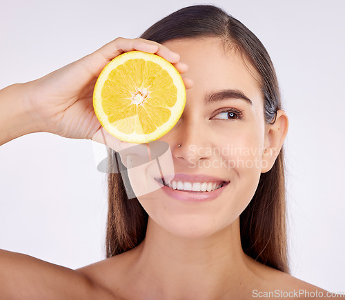 Image of Beauty, studio face and happy woman with lemon for skincare glow, vitamin c detox and natural facial exfoliation. Fruit, organic cosmetics and person with citrus product benefits on white background