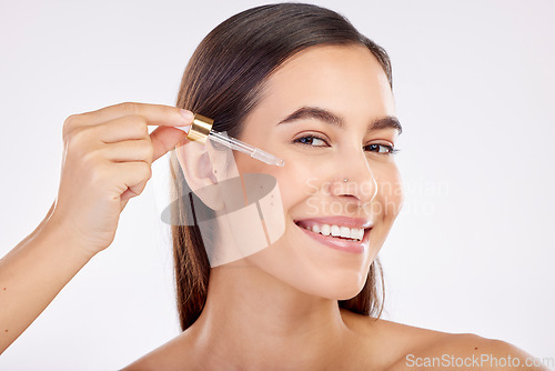 Image of Beauty, skincare portrait and happy woman with serum hydration glow, anti aging or skin protection. Person with liquid spa product, collagen oil or hyaluronic acid for face care on white background