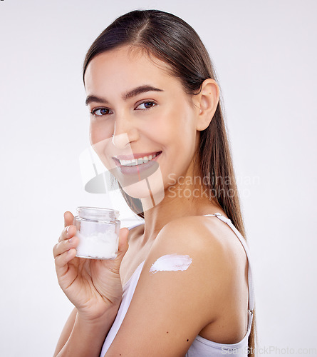 Image of Body, skincare and woman with cream jar isolated on a white background in studio. Portrait, happy and model with sunscreen on shoulder, natural cosmetics or lotion for beauty, dermatology and health