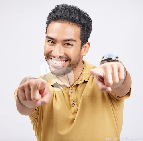 Image of Portrait, smile of Asian man and pointing to you in studio isolated on a white background. Face, happy and person with choice, decision or selection of option, winner and hiring, recruitment and vote