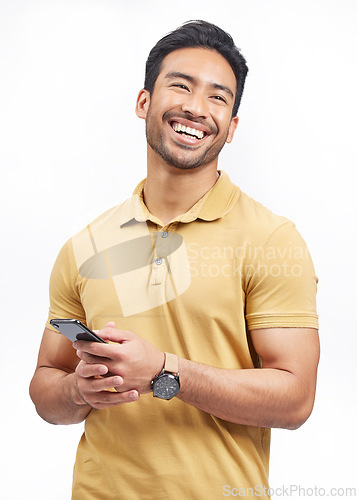 Image of Happy, funny and Asian man with a smartphone, connection and social media on a white studio background. Person, network and model with a cellphone, mobile app and humor with a notification and email