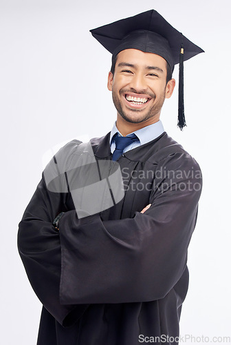 Image of Student man, arms crossed and graduation in studio portrait, smile and success by white background. Young guy, happy university graduate and education achievement with pride, goals and celebration