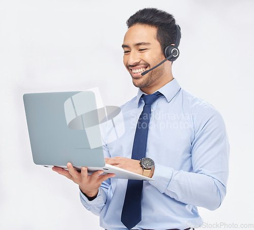 Image of Call center, laptop and Asian man telemarketing, support or contact us isolated on a white studio background. Computer, smile and sales agent, customer service or consultant on internet for crm email