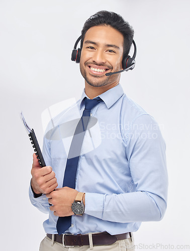 Image of Call center, portrait and Asian man with documents for telemarketing, crm support and consulting isolated on a white studio background. Face, smile and sales agent with paperwork for customer service