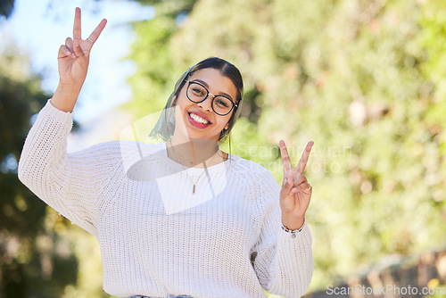 Image of Peace sign, woman portrait and outdoor with a smile of student on summer holiday and vacation. Motivation, happy and emoji v hand gesture feeling silly with freedom and female person from Sudan