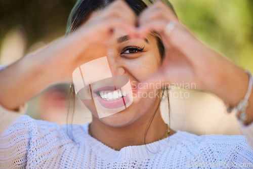 Image of Heart hands, love and smile with portrait of woman in park for support, health and kindness symbol. Peace, emoji and motivation with person and gesture in nature for empathy, trust and valentines day