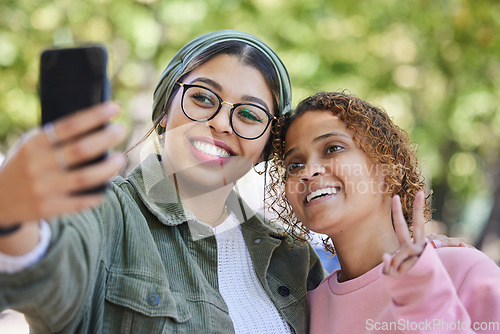 Image of Women friends, selfie and peace sign at park with smile, hug or emoji for memory, blog or post on web. Muslim girl, gen z students and happy for profile picture, photography or icon for social media