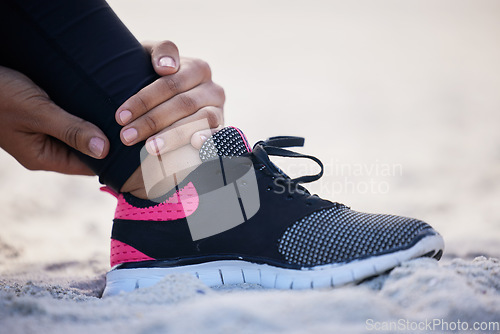 Image of Fitness, ankle pain and sports injury with woman on beach for running, inflammation and accident. Emergency, healthcare and muscle with closeup of runner for exercise, physical therapy and workout