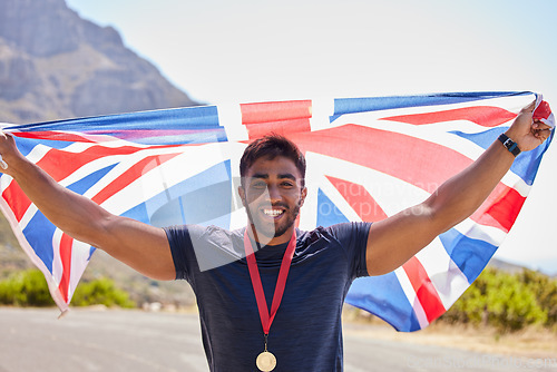 Image of UK, runner and portrait of happy man with flag on road for fitness goal, success or running race competition. Proud champion winner, winning or excited British athlete with victory or gold medal