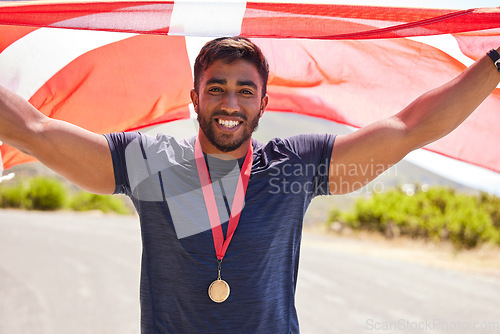 Image of Portrait, flag and man with a medal for winner, sports competition or winner in the street. Happy, Denmark and a professional athlete with representation of a country in running or national triathlon